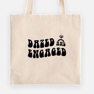 Dazed and engaged tote bag